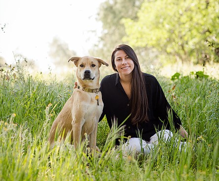 Paloma, our certified professional groomer, with a dog